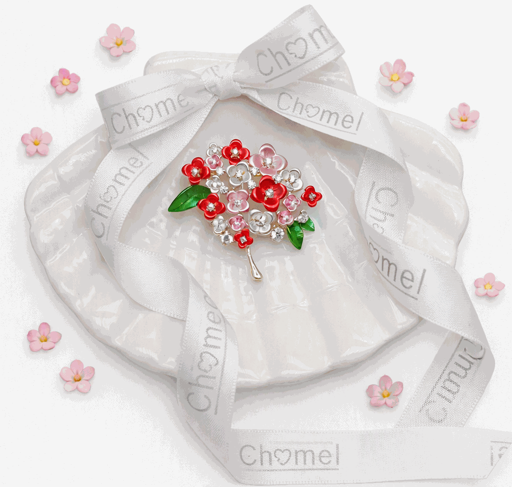 Cubic Zirconia Brooch with a bouquet of red and pink enamel flowers, clear sparkling stones, green leaves and gold-tone pin.