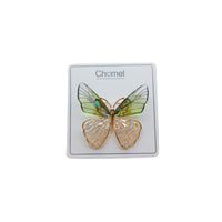 Butterfly cubic zirconia brooch with gold-tone edging, translucent green and peach enamel wings, and sparkling accents.