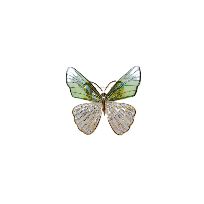 Butterfly cubic zirconia brooch with translucent green enamel upper wings, sparkling clear lower wings and gold-tone edging.