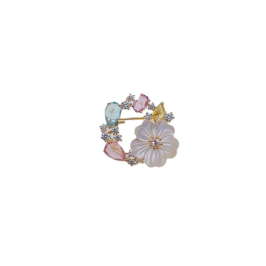 Gold plated flower cubic zirconia brooch with pastel simulated moonstone stones and C clasp closure