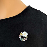 Gold plated flower cubic zirconia brooch with pastel simulated moonstone stones and pin clasp closure
