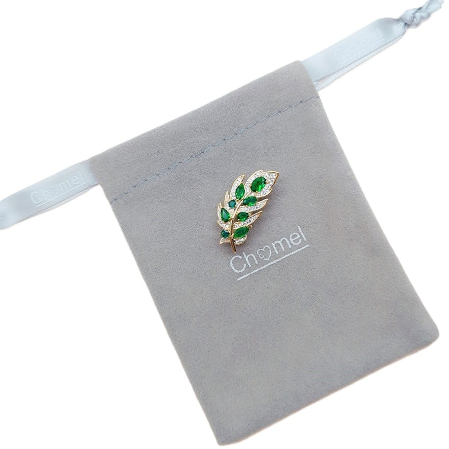 Gold-plated maple leaf cubic zirconia brooch with green stones and C clasp closure