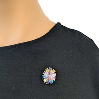 Gold plated oval cubic zirconia brooch with colored stones and C clasp closure