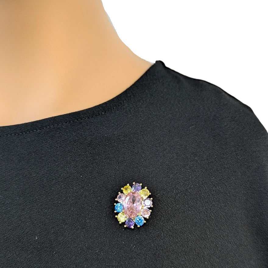 Gold plated oval cubic zirconia brooch with colored stones and C clasp closure