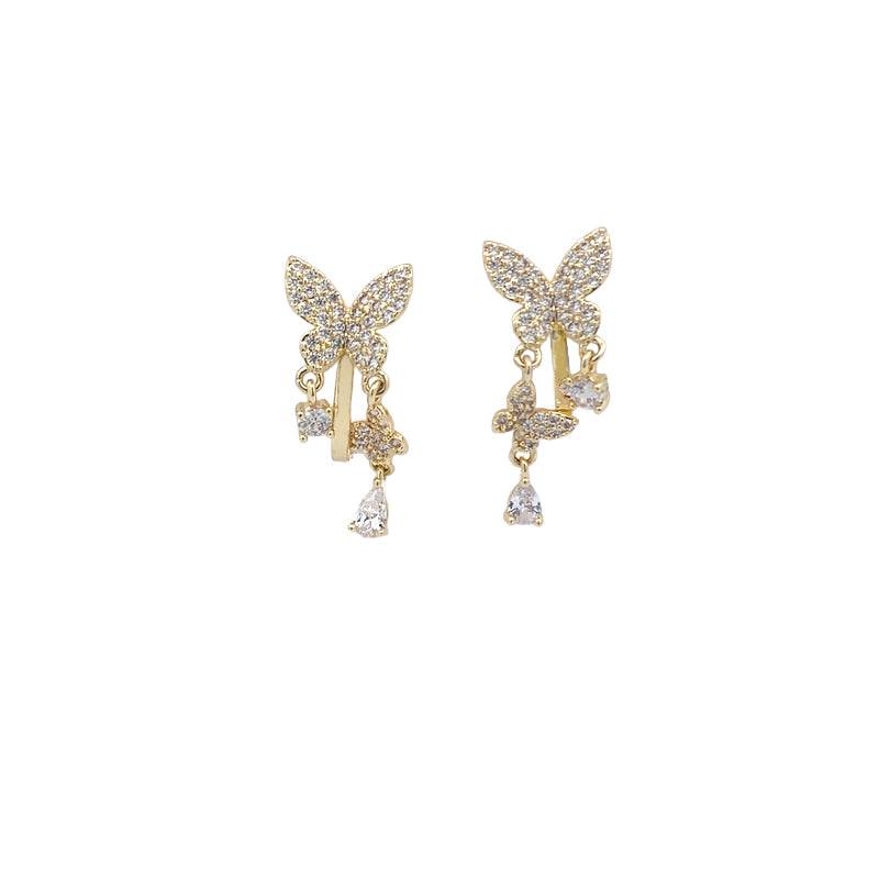 Gold-plated butterfly cubic zirconia clip-on earrings with dangling butterfly and teardrop solitaire drops