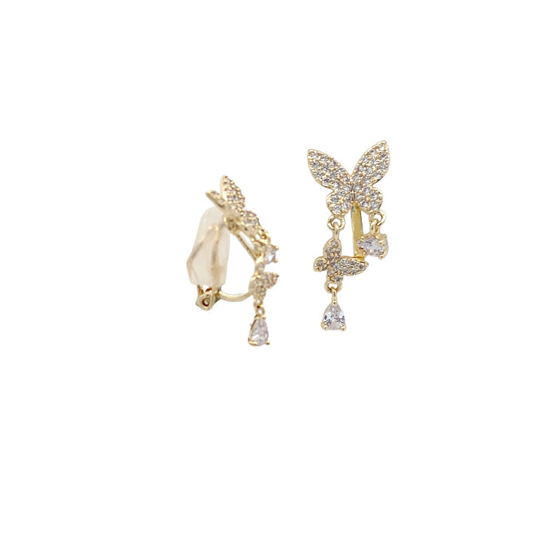 Gold-plated butterfly cubic zirconia clip-on earrings with dangling butterfly and teardrop solitaire drops