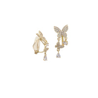 Gold-plated butterfly cubic zirconia clip-on earrings with dangling butterfly and teardrop solitaire drops
