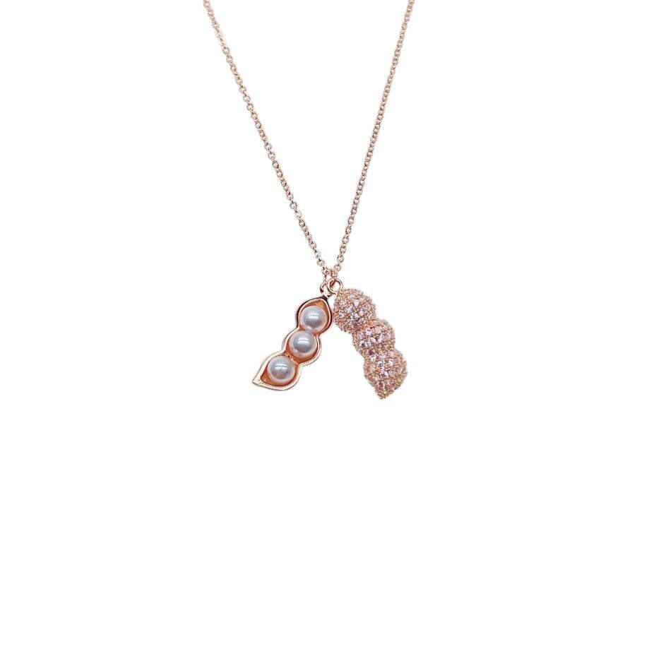 Rose gold peanut cubic zirconia necklace with three simulated pearls on adjustable chain