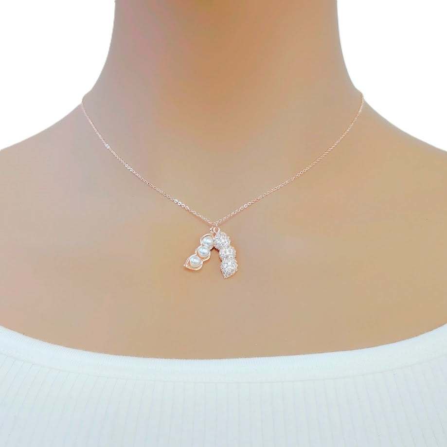 Rose gold peanut cubic zirconia necklace with three simulated pearls and adjustable chain