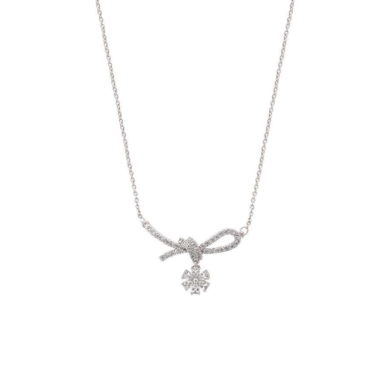 Ribbon cubic zirconia necklace with rhodium plated ribbon pendant and dangling solitaire on chain