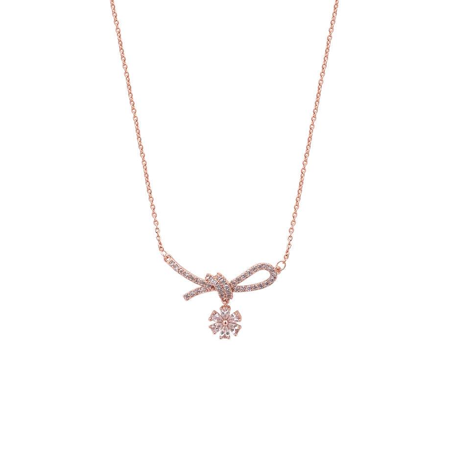 Rosegold ribbon cubic zirconia necklace with dangling solitaire pendant on chain