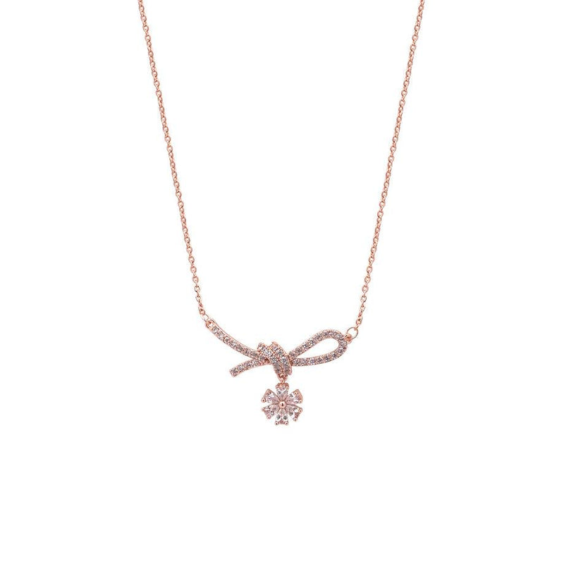 Rosegold ribbon cubic zirconia necklace with dangling solitaire pendant on chain