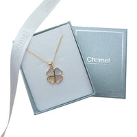 Gold-tone clover pendant necklace with sparkling stones and open heart-shaped petals; Butterfly Cubic Zirconia style on a fine chain.