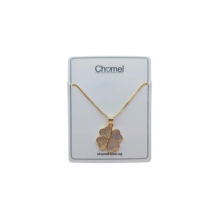 Gold-tone necklace with a clover pendant of sparkling pavé and smooth heart-shaped inlays; Butterfly Cubic Zirconia detail.