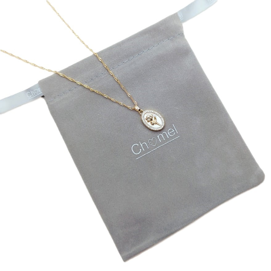 Gold-tone fine chain necklace with oval mother-of-pearl pendant, gold flower detail and sparkling border; Butterfly Cubic Zirconia style.