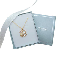 Clover pendant necklace with a gold-tone chain, four heart-shaped petals and a textured gold petal; Butterfly Cubic Zirconia accents.