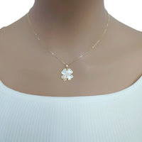 Gold-tone necklace with a fine chain and a white clover pendant accented by a sparkling stone; Butterfly Cubic Zirconia style.
