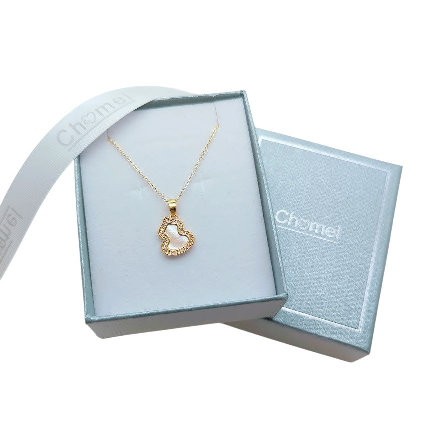 Gold-tone Dream Catcher Cubic Zirconia Necklace with a delicate chain and heart-shaped openwork pendant edged in sparkling stones.