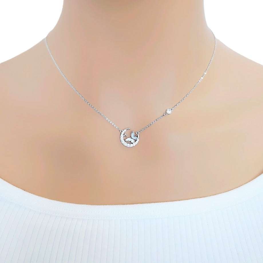 Moon and Butterfly Necklace with cubic zirconia moon and mother of pearl butterfly pendant on rhodium plated adjustable chain