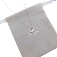 Moon and Butterfly Necklace with cubic zirconia moon and mother of pearl butterfly pendant on rhodium plated chain