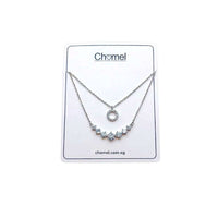 Tiered cubic zirconia necklace with round pendant and graduating solitaire stones on rhodium plated chain