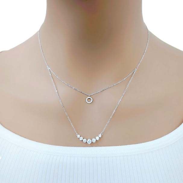 Tiered cubic zirconia necklace with round pendant and graduating solitaires on rhodium plated chain