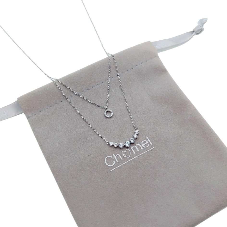 Tiered cubic zirconia necklace with round pendant and graduating solitaire on rhodium plated chain