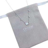 Double heart cubic zirconia necklace with mother of pearl pendant on rhodium-plated chain