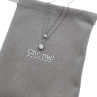 Elegant cubic zirconia necklace with dual layered 4mm and 7mm solitaires, rhodium plated finish