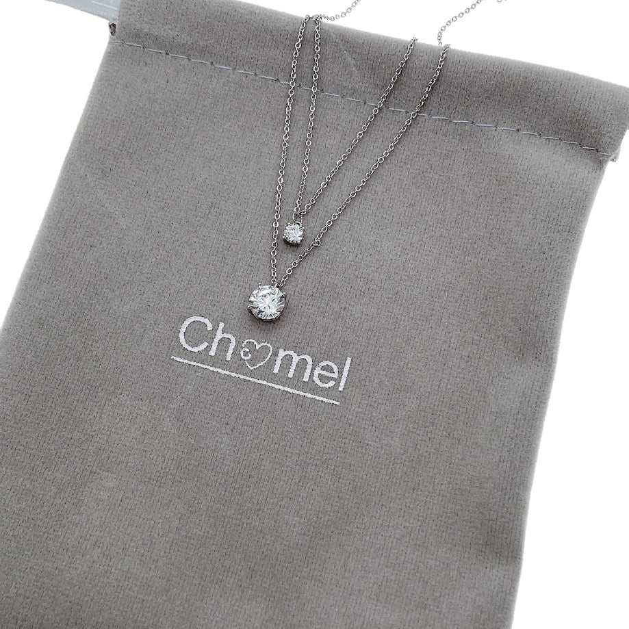 Elegant cubic zirconia necklace with dual layered 4mm and 7mm solitaires, rhodium plated finish