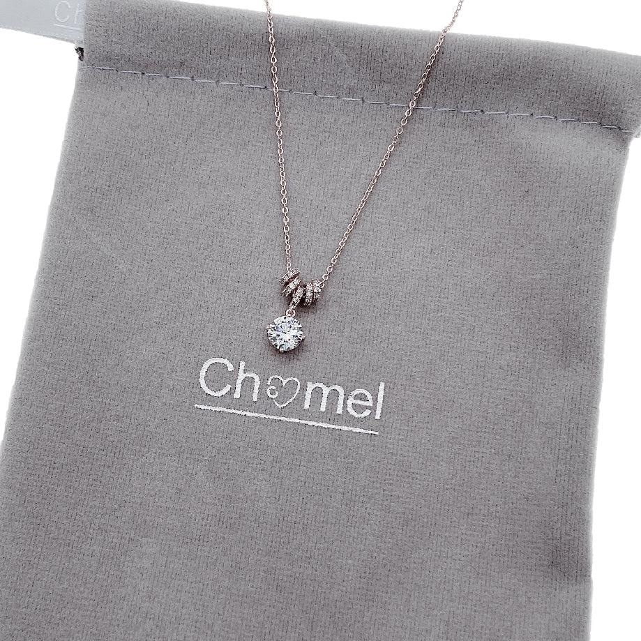 Lock & Key Cubic Zirconia Necklace with 6mm solitaire pendant and 4 moveable slider rings, rhodium plated finish