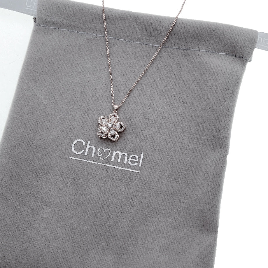 Spinning flower necklace with cubic zirconia pendant on adjustable rhodium plated chain