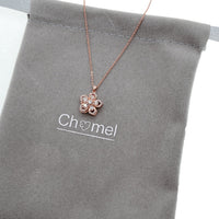 Rosegold plated flower necklace with spinning cubic zirconia pendant on adjustable chain