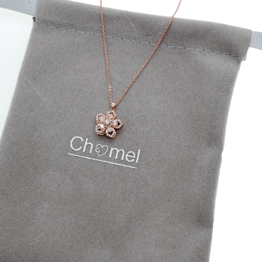 Rosegold plated flower necklace with spinning cubic zirconia pendant on adjustable chain