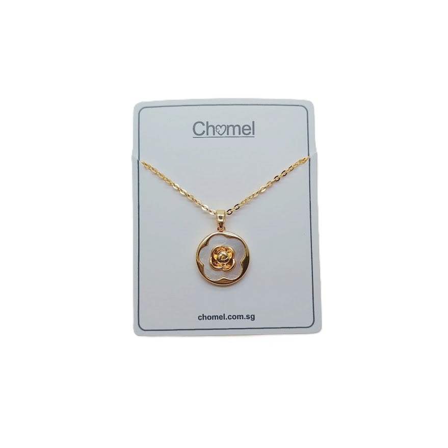 Gold-plated necklace with a round mother-of-pearl pendant and raised flower detail; Butterfly Cubic Zirconia style.