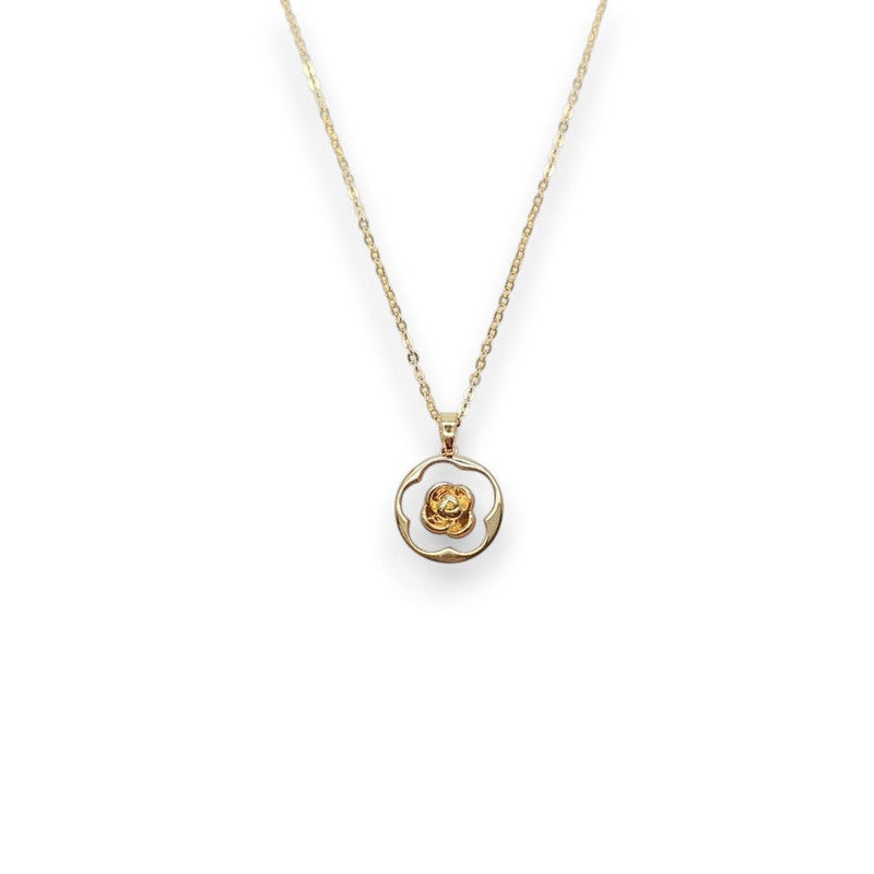 Gold-tone necklace with a round white mother-of-pearl pendant, wavy gold border and raised flower detail; Butterfly Cubic Zirconia style.
