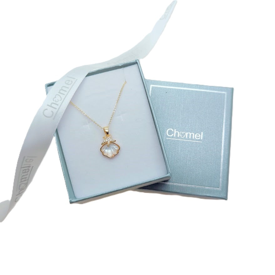Gold-tone chain necklace with a pearl-like shell pendant and delicate starfish detail, Butterfly Cubic Zirconia accent.