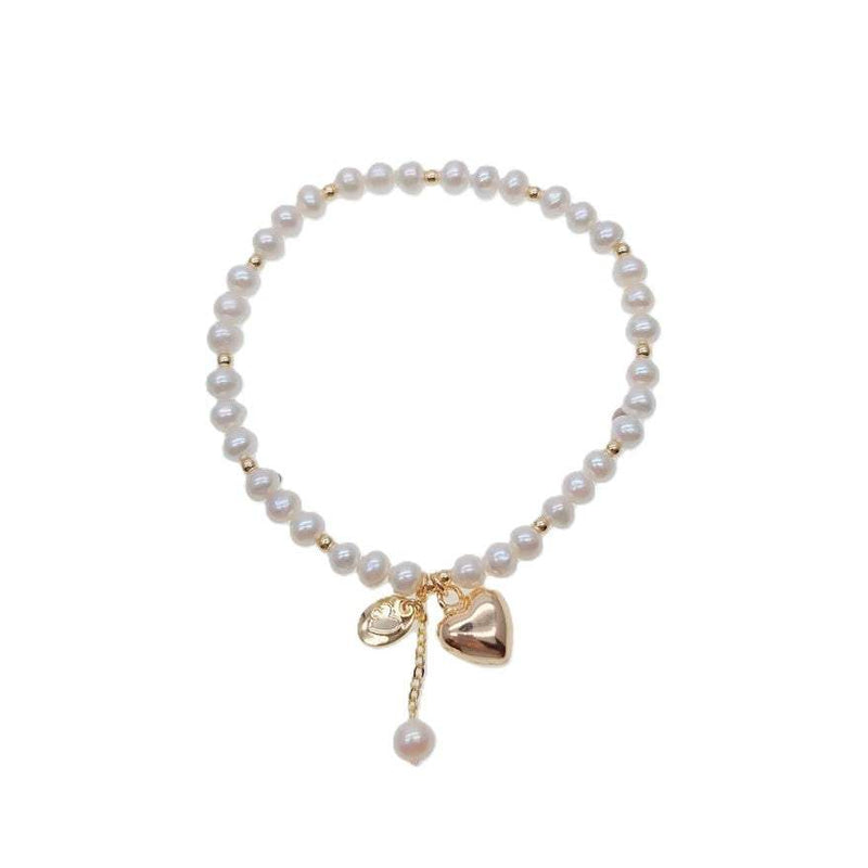 Freshwater pearl bracelet with alternating gold beads and heart charm on elastic band