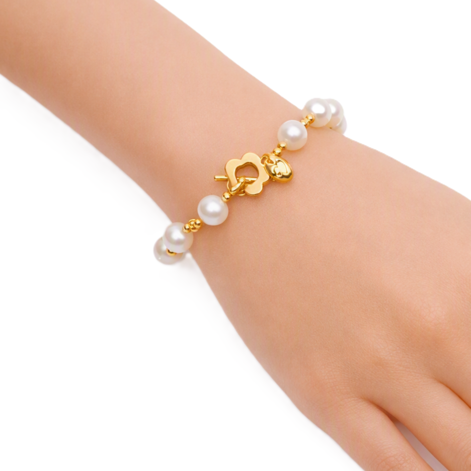 Freshwater Pearl Bracelet with lustrous white 9mm pearls and gold beads, featuring a gold-plated floral toggle clasp.