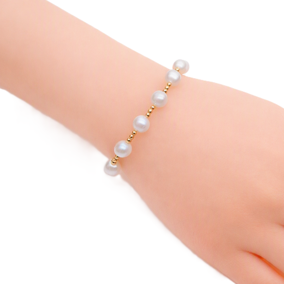 Freshwater Pearl Bracelet featuring 9mm white pearls alternating with small gold beads and a gold-plated toggle clasp.
