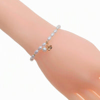 Freshwater pearl bracelet with alternating gold beads and flower charm