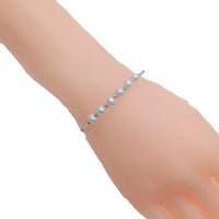 Freshwater Pearl Bracelet featuring small round white pearls with a rhodium-plated chain and a spring clasp closure.