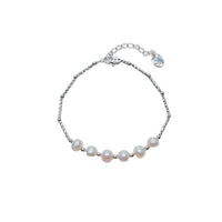 Freshwater Pearl Bracelet with six 6-7mm white roundish-potato pearls on a rhodium plated chain and spring clasp.