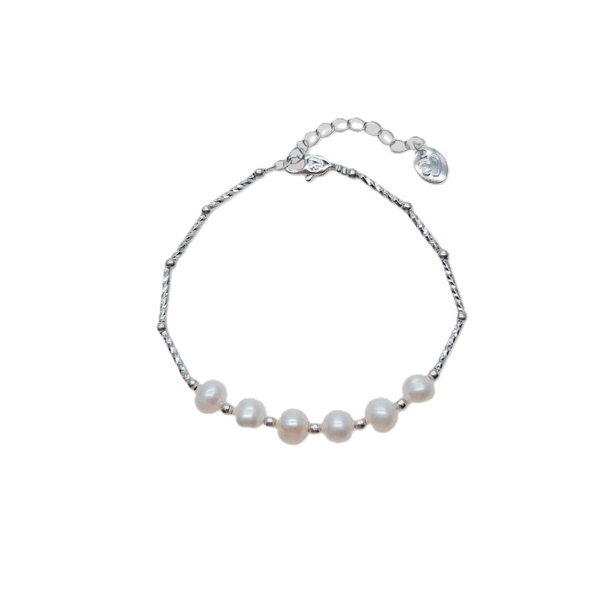 Freshwater Pearl Bracelet with six 6-7mm white roundish-potato pearls on a rhodium plated chain and spring clasp.