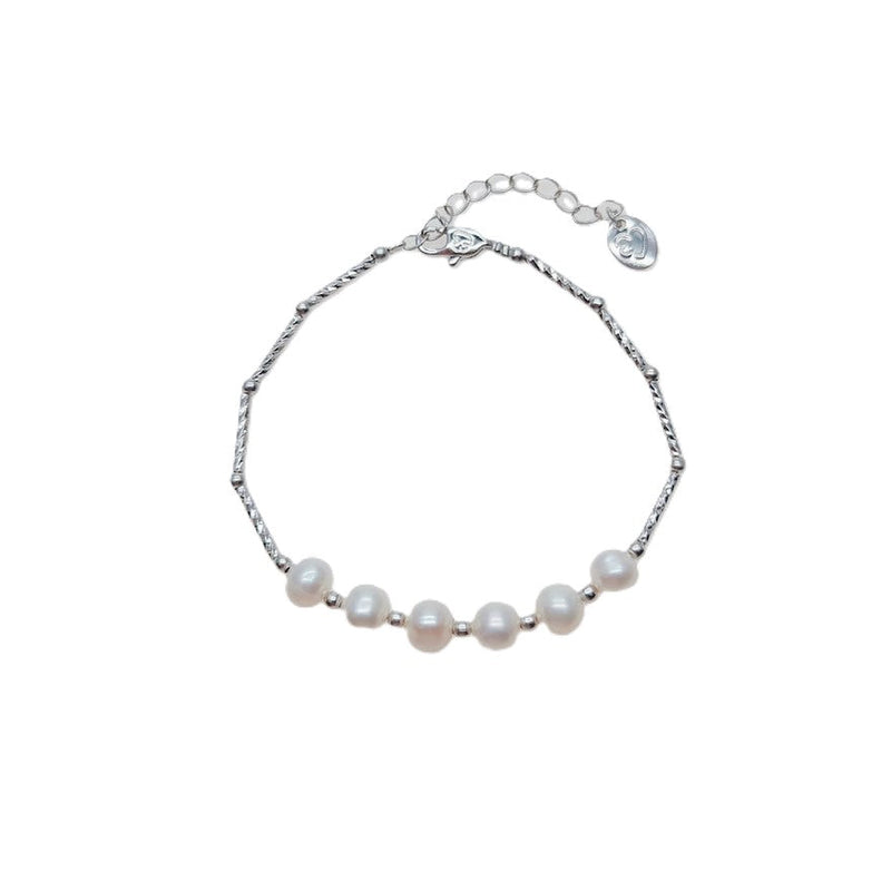 Freshwater Pearl Bracelet with six 6-7mm white roundish-potato pearls on a rhodium plated chain and spring clasp.