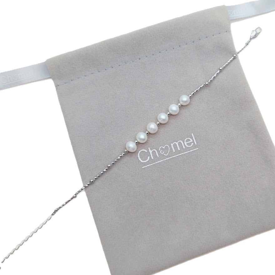 Freshwater Pearl Bracelet featuring seven white roundish-potato shaped pearls on a delicate silver chain with spring clasp