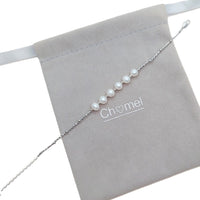 Freshwater Pearl Bracelet featuring seven white roundish-potato shaped pearls on a delicate silver chain with spring clasp