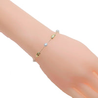 Freshwater Pearl Bracelet with white 5-6mm pearls and gold-plated chain and beads, adjustable sliding design.
