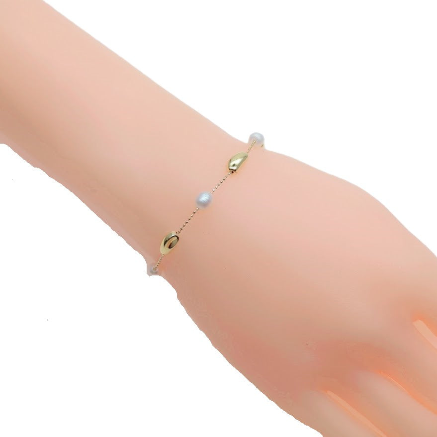 Freshwater Pearl Bracelet with white 5-6mm pearls and gold-plated chain and beads, adjustable sliding design.