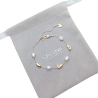 Freshwater Pearl Bracelet featuring white freshwater pearls and gold-plated beads on an adjustable delicate gold chain